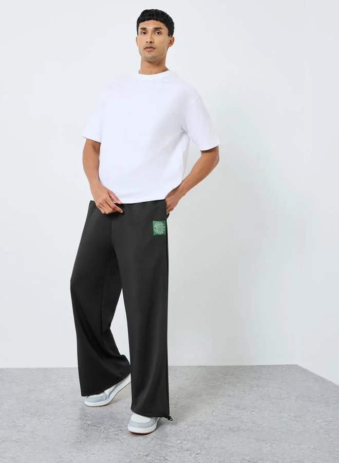 Men Black Wide Leg Scuba Joggers with Patch